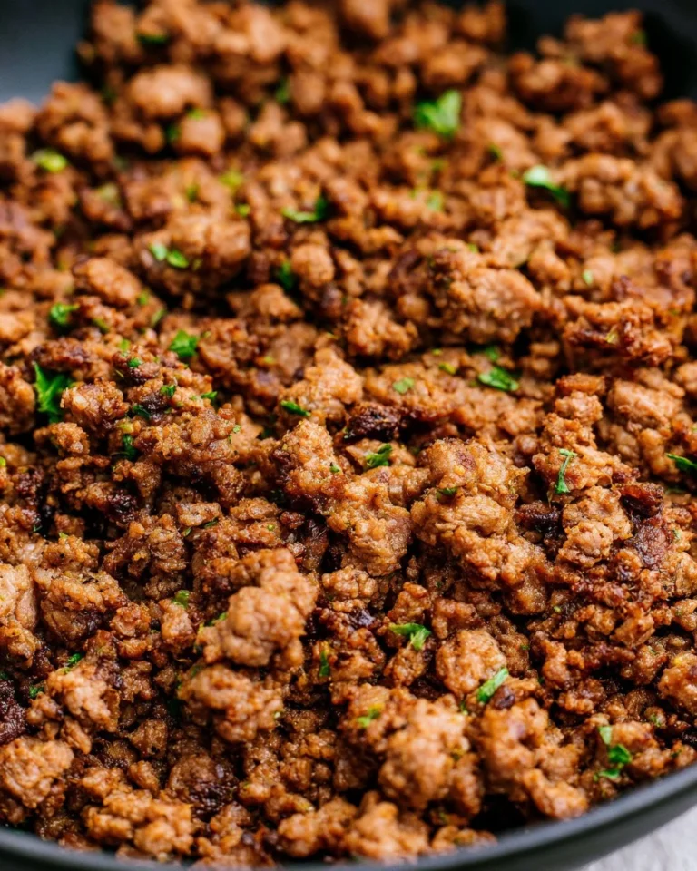 Air Fryer Ground Beef cooking in an air fryer, ready to be served.