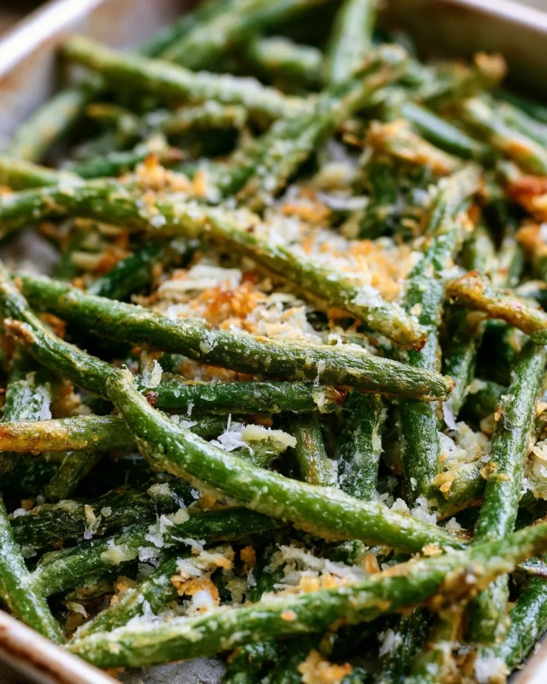 Cheesy garlic frozen roasted green beans in a serving dish.