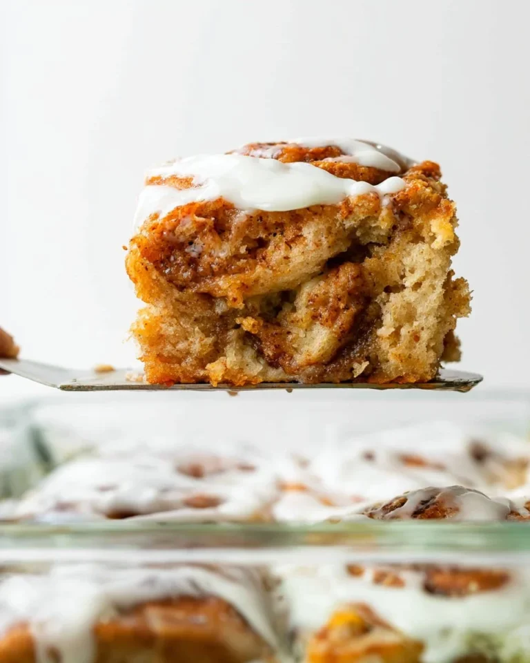 Cinnamon roll butter swim biscuits served warm with a drizzle of icing.