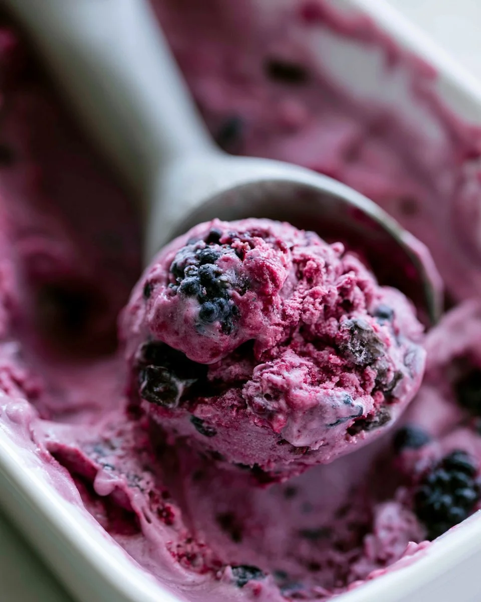 No-churn blackberry chocolate chunk ice cream served in a bowl