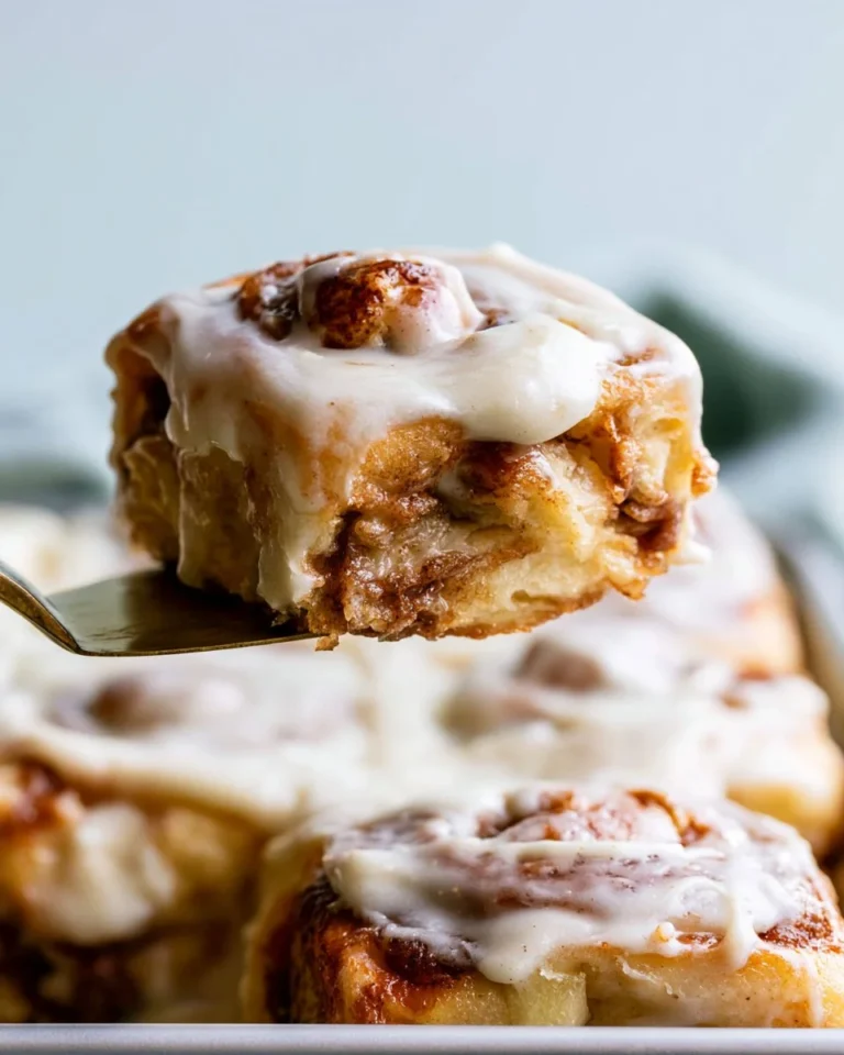 Delicious Hawaiian Roll Cinnamon Rolls freshly baked and topped with icing.