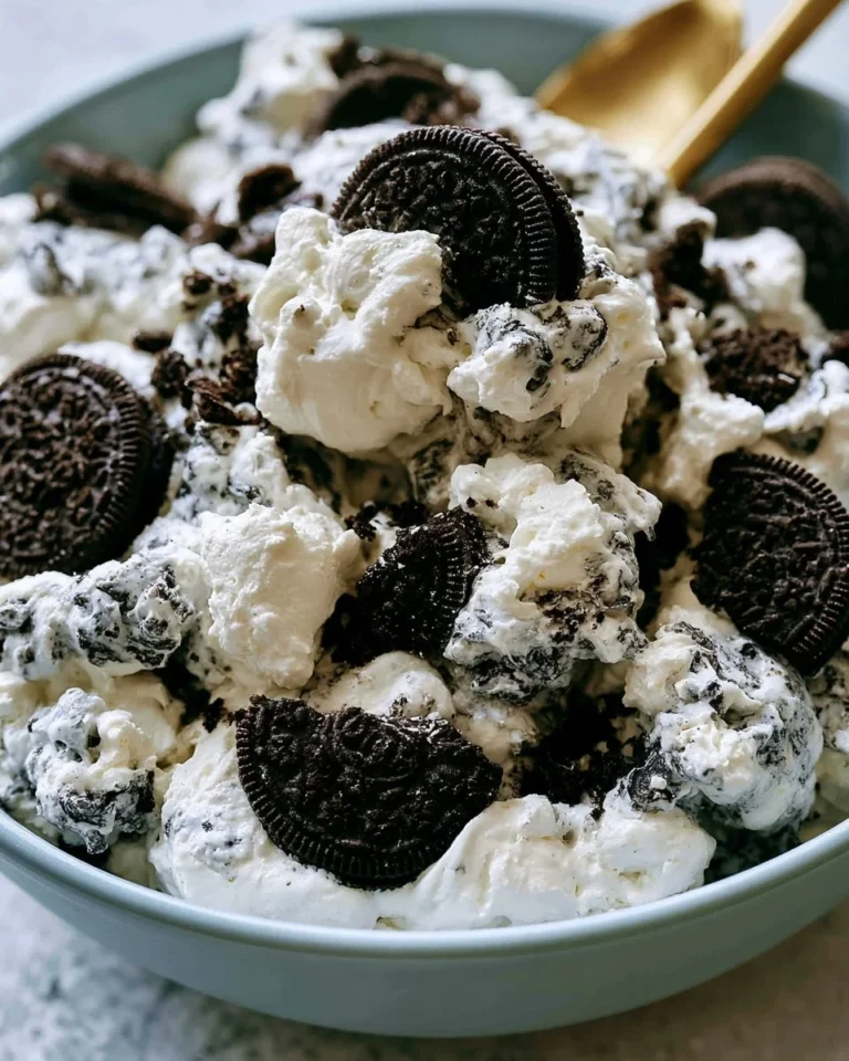 Delicious Oreo Fluff Dessert Salad in a bowl, garnished with crushed Oreos.