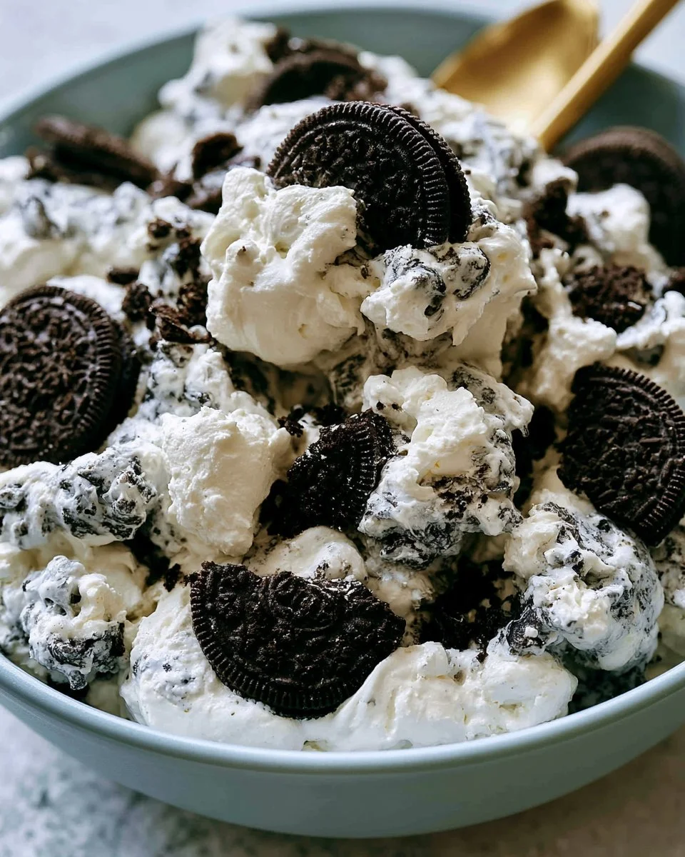 Delicious Oreo Fluff Dessert Salad in a bowl, garnished with crushed Oreos.
