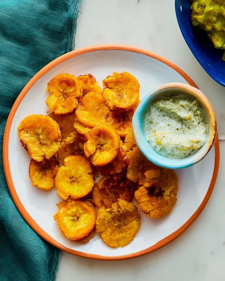 Crispy baked tostones served on a plate, golden and delicious.