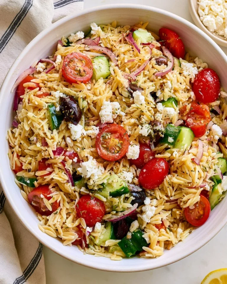 Delicious Greek Orzo Salad with fresh vegetables and feta cheese