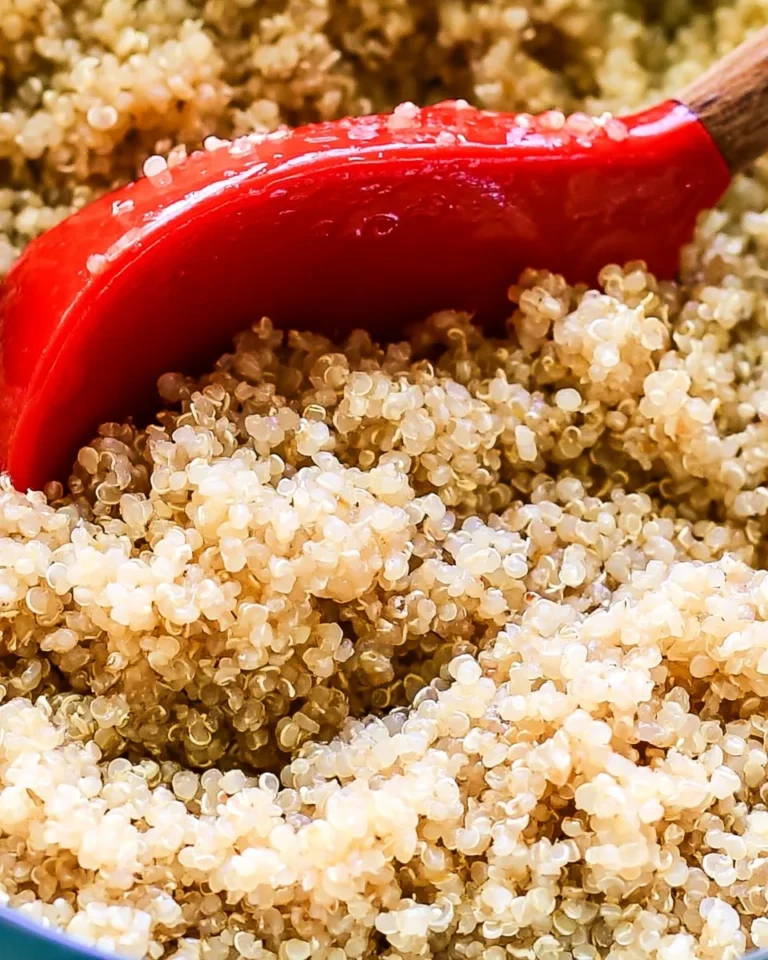 Cooked quinoa with a fresh salad mix for a nutritious meal
