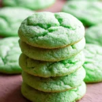 Soft and chewy green sugar cookies on a plate, perfect for any celebration.